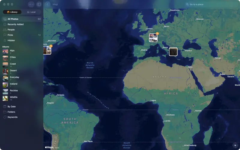 A map with groups of photos over Iceland, the Alps and North America