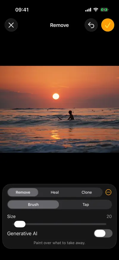 A surfer on a wave at sunset, open in Remove