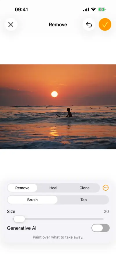 A surfer on a wave at sunset, open in Remove