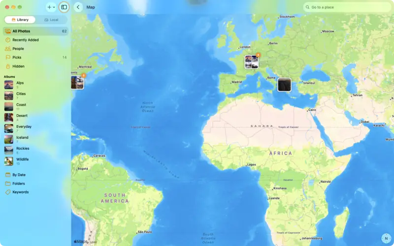 A map with groups of photos over Iceland, the Alps and North America