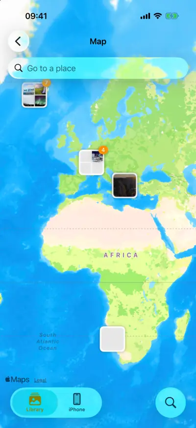A map with groups of photos over Iceland, the Alps and North America